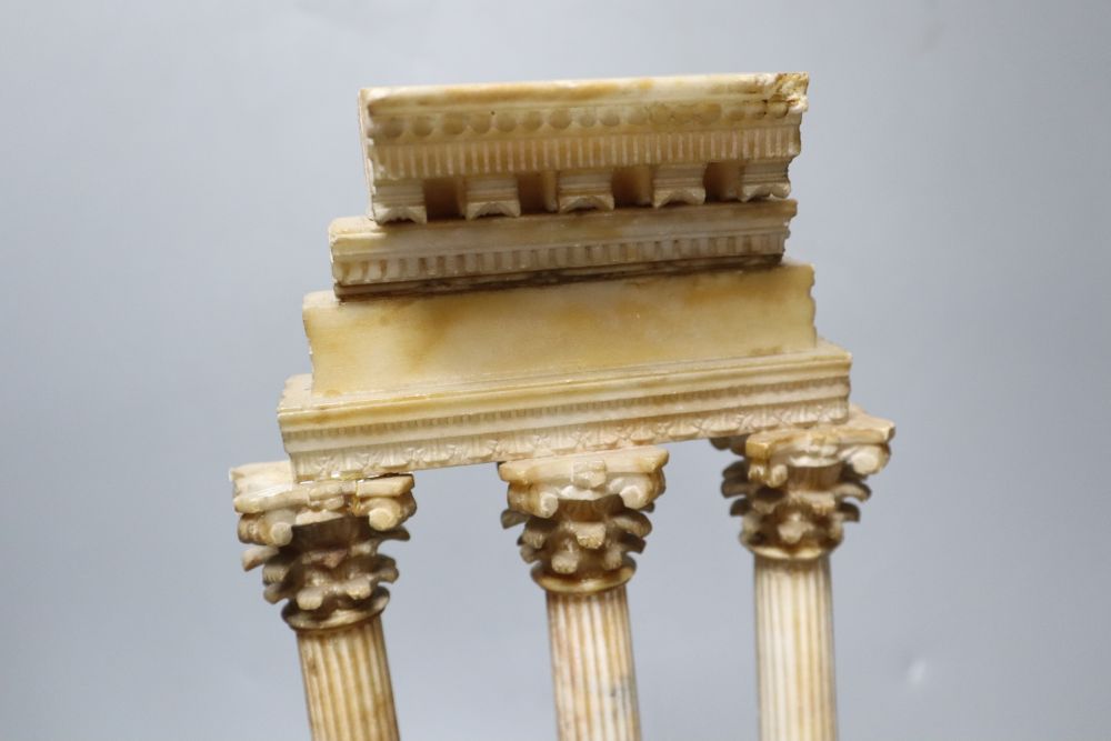 After the Antique. A Grand Tour carved and stained alabaster model of Ruins, height 34cm